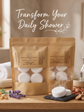 Shower steamer pucks in natural paper packaging upon a wood table bathroom scene with botanicals. Spirit Led Creative. Made in Michigan. Small Batch. Essential oils